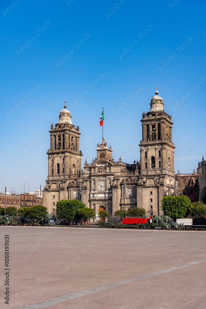The Metropolitan Cathedral in Mexico City’s Zocalo Square with the Mexican flag, showcasing historic architecture and a vibrant urban setting. The Metropolitan Cathedral in Mexico City’s Zocalo Square with the Mexican flag, showcasing historic architecture and a vibrant urban setting.