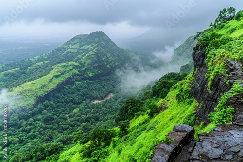 Lush Green Mountains Under Cloudy Sky in Monsoon Season with Mist Rolling Over Valleys and Scenic View of Nature's Beauty in Western Ghats Region photo