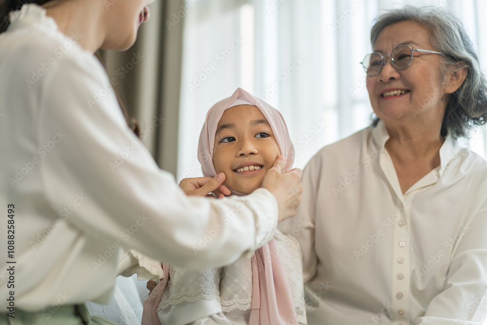 Obraz premium Multi generational asian family bonding at home, grandmother, mother, and daughter play together, happy family moments, diverse family values, joyful connection, smiling and warmth, candid lifestyle