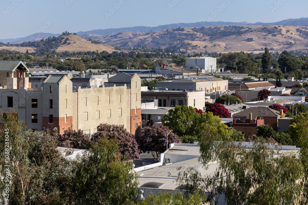 Fototapeta premium Hollister, California, USA - September 2, 2024: Afternoon light shines on buildings in the historic downtown district.