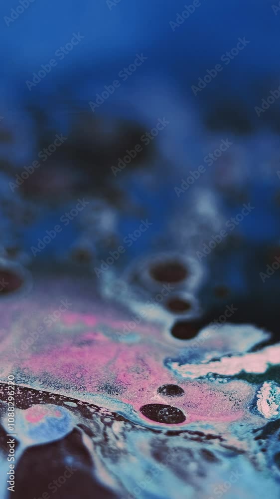 Vertical video. Paint bubbles. Oil fluid. Ink mix. Defocused blue pink black color glitter foam texture emulsion blend flow motion abstract art background. Vertical video. Paint bubbles. Oil fluid. Ink mix. Defocused blue pink black color glitter foam texture emulsion blend flow motion abstract art background.