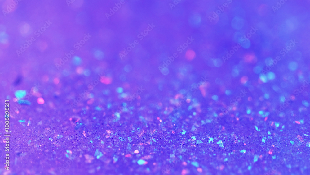 Sparkling fluid. Liquid shimmer flow. Blur purple color shiny holographic glitter particles gel emulsion paint gloss spill abstract art background with bokeh lights. Sparkling fluid. Liquid shimmer flow. Blur purple color shiny holographic glitter particles gel emulsion paint gloss spill abstract art background with bokeh lights.