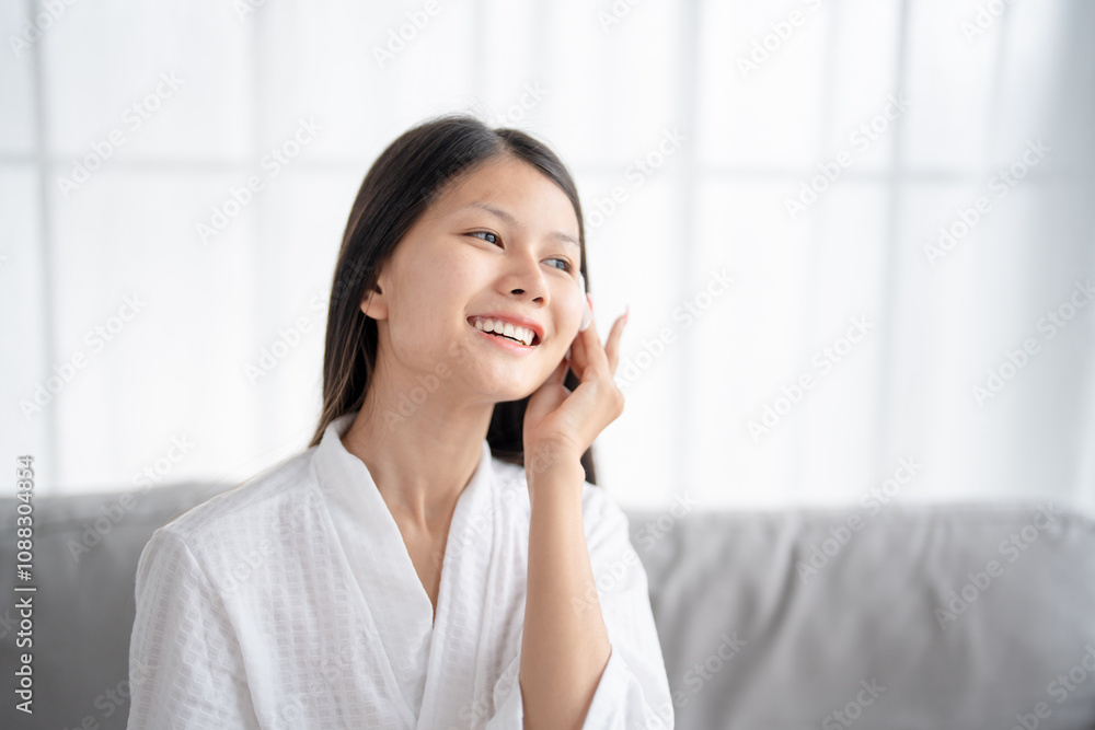 Daily beauty routine Asian woman.with clean skin uses micellar water to remove makeup Daily beauty routine Asian woman.with clean skin uses micellar water to remove makeup