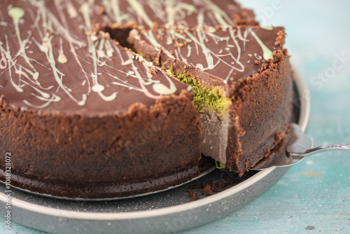 Photography Dubai chocolate cheesecake  with  kataifi and pistachio paste