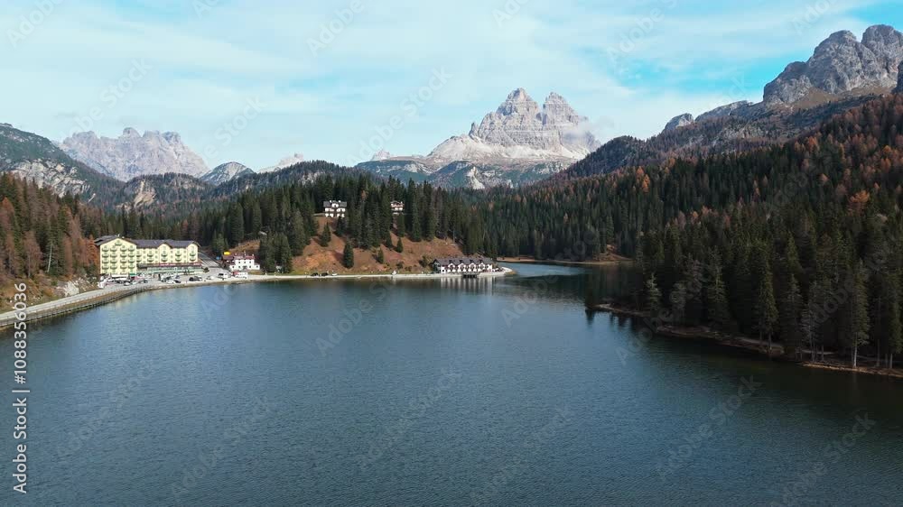 Misurina Lake with Tre Cime di Lavaredo peaks in the Italian Dolomites, serene autumn scenery Misurina Lake with Tre Cime di Lavaredo peaks in the Italian Dolomites, serene autumn scenery