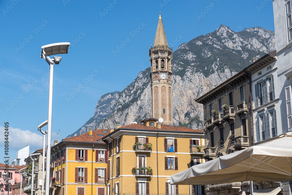 Naklejka premium Lecco city, Italy, on lake Como. Historic center, square XX Settembre with the bell tower of San Nicolò, one of the symbols of the city, 96 meters high, is among the ten highest bell towers in Italy