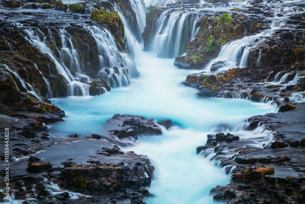Gorgeous view of the Bruarfoss waterfall or Bridge Falls on Bruara river. Location place southern region of Iceland, Europe. Gorgeous view of the Bruarfoss waterfall or Bridge Falls on Bruara river. Location place southern region of Iceland, Europe.