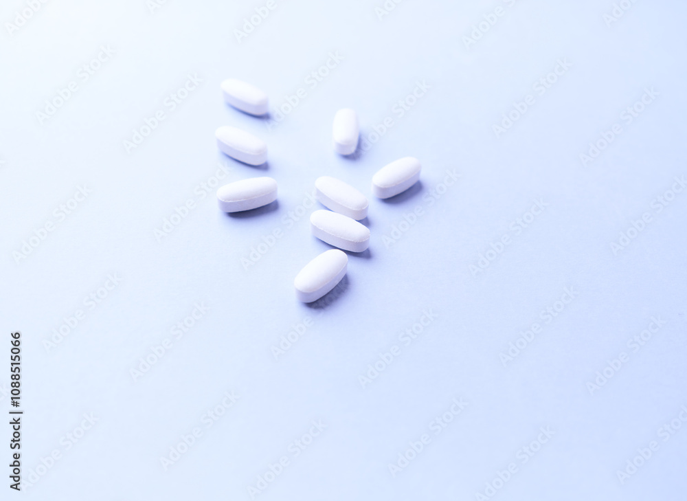 Amino acids tablets. Nutrition for bodybuilding. Fitness supplements on bright background. Soft focus. Copy space. Amino acids tablets. Nutrition for bodybuilding. Fitness supplements on bright background. Soft focus. Copy space.