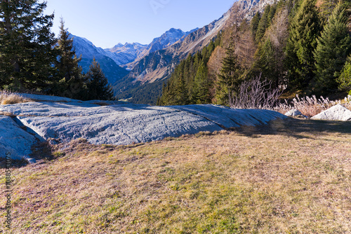 Beautiful mountain panorama in the Swiss Alps with Bregaglia Valley seen from viewpoint of mountain village Maloja on a sunny autumn day. Photo taken November 15th, 2024, Maloja, Switzerland. photo