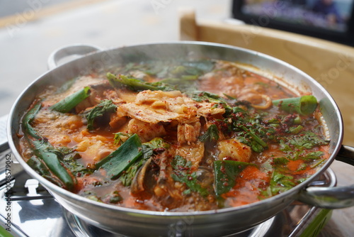 korean spicy stew made by boiling fish and vegetables with red pepper paste