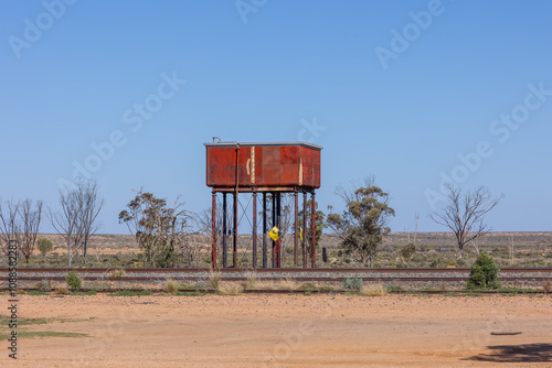 Fotografie A water tank on stilts for steam locomotives, now abandoned at a declining and isolated Olary village which used to be a service centre and station during the heyday of locomotives in South Australia