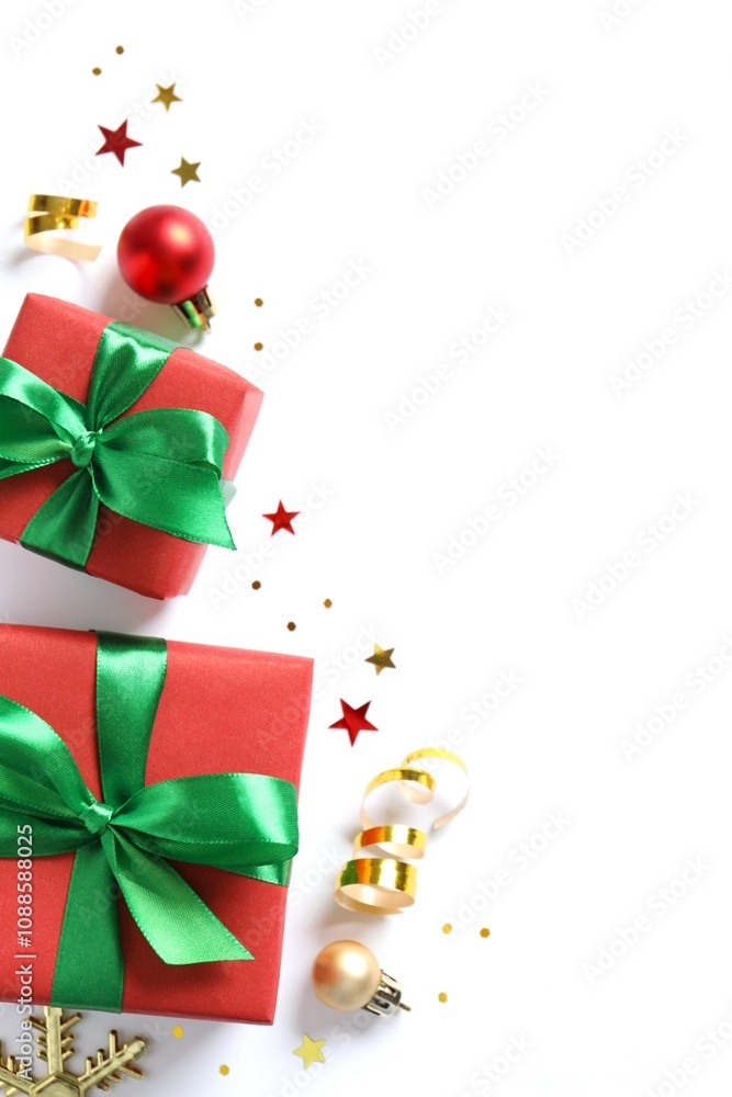 Beautiful gift box tied with bow and Christmas decorations on white background Beautiful gift box tied with bow and Christmas decorations on white background