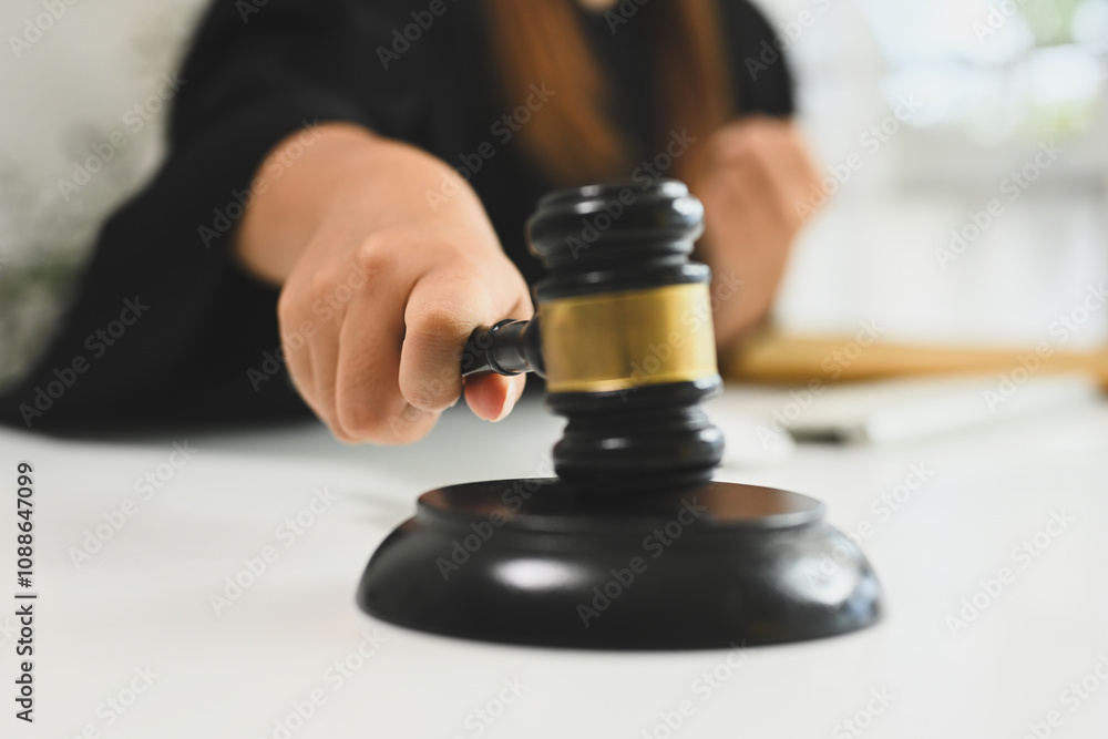 Close up of a judge hand holding gavel hammer mallet Close up of a judge hand holding gavel hammer mallet