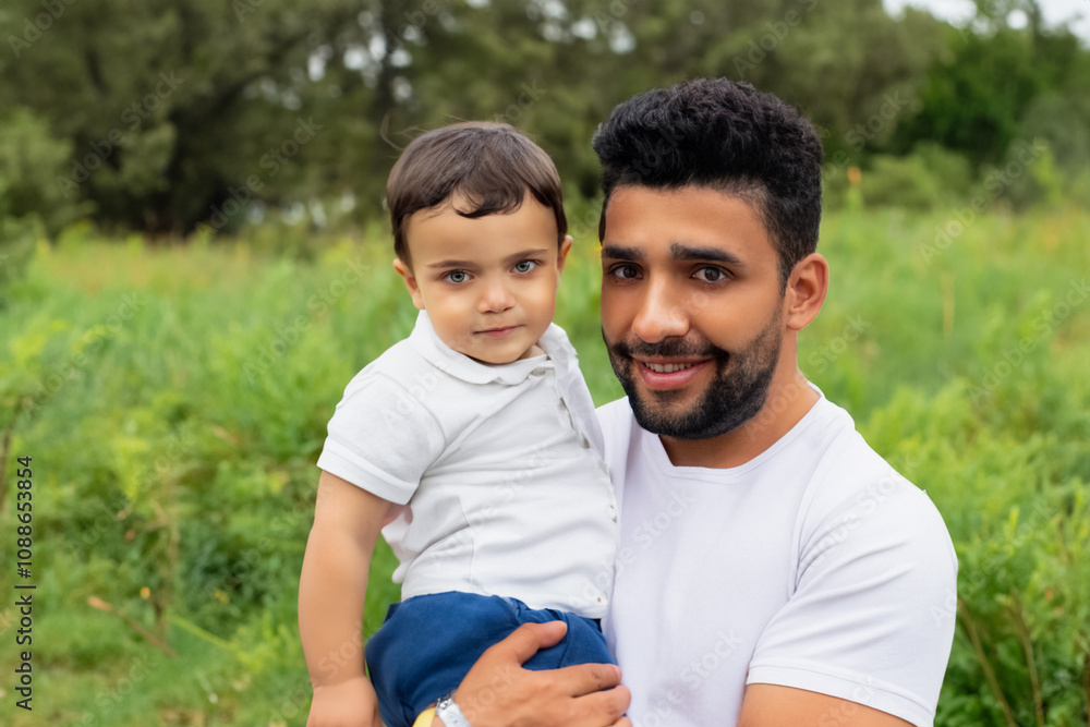 Dad and son playing the forest with nature. family boy father concept. dad holding his son in his arms in the forest. dad holding his son in his arms lifestyle in the forest. Dad and son playing the forest with nature. family boy father concept. dad holding his son in his arms in the forest. dad holding his son in his arms lifestyle in the forest.