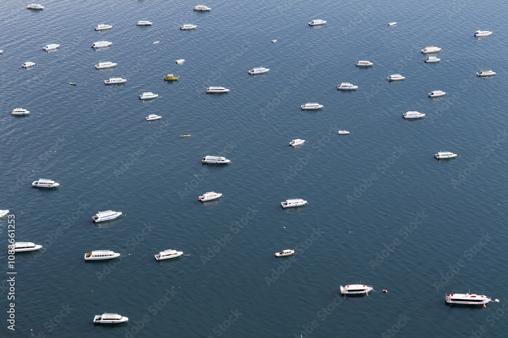 Lots of boats aligned in the same direction on the Lake Titicaca, Bolivia. The alignment is spectacular and the picture makes a perfect abstraction. Lots of boats aligned in the same direction on the Lake Titicaca, Bolivia. The alignment is spectacular and the picture makes a perfect abstraction.