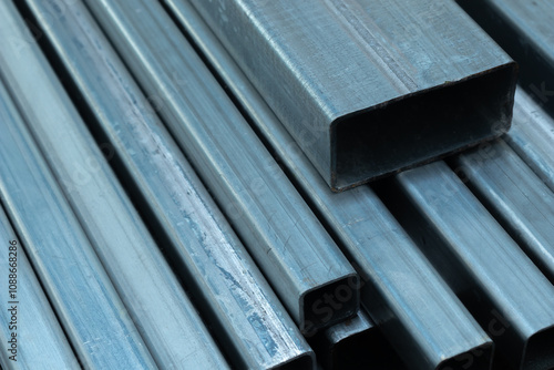 Group of galvanize rectangular steel tube background. Selective focus.