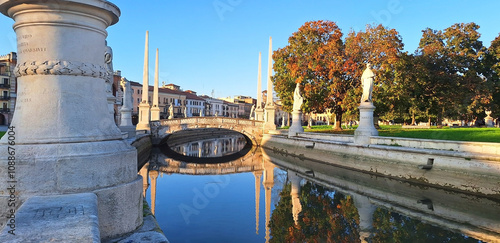 Prato della Valle with statues Prato della Valle with statues with reflection in the water in autumn. Famous landmarks in Padova. photo