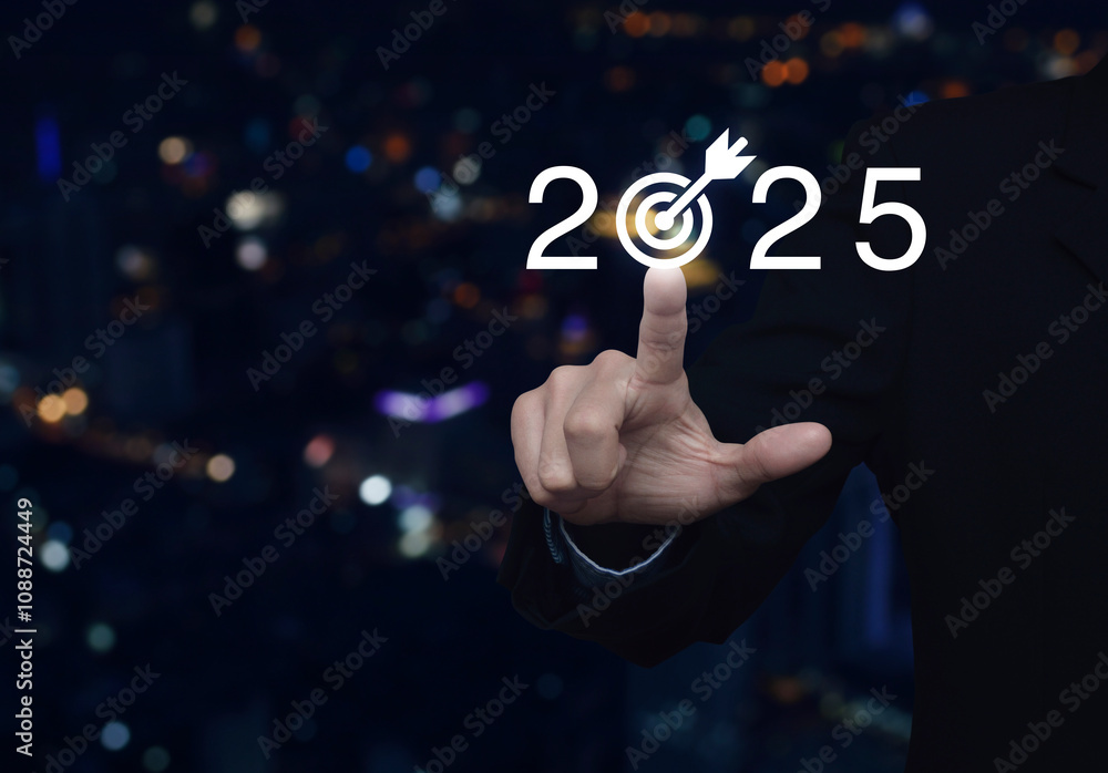 Businessman pressing 2025 letter with goal icon over blur colorful night light modern city tower and skyscraper, Business happy new year 2025 success concept Businessman pressing 2025 letter with goal icon over blur colorful night light modern city tower and skyscraper, Business happy new year 2025 success concept