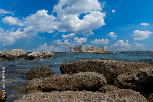 Obraz na płótnie Cloudy sky and Maiden Castle (Kız Kalesi) and rocky field - Mersin, Türkiye. w salonie