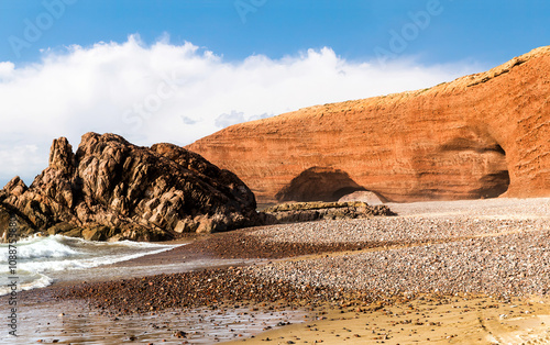 Spectacular natural red arch on atlantic ocean coast, Legzira (or Gzira) beach. Red archs on atlantic ocean coast. Sidi Ifni, Morocco, Africa photo