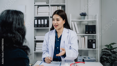 Doctor's Consultation: A young female doctor attentively listens to a concerned patient, showcasing the importance of patient care and communication in a medical setting. 