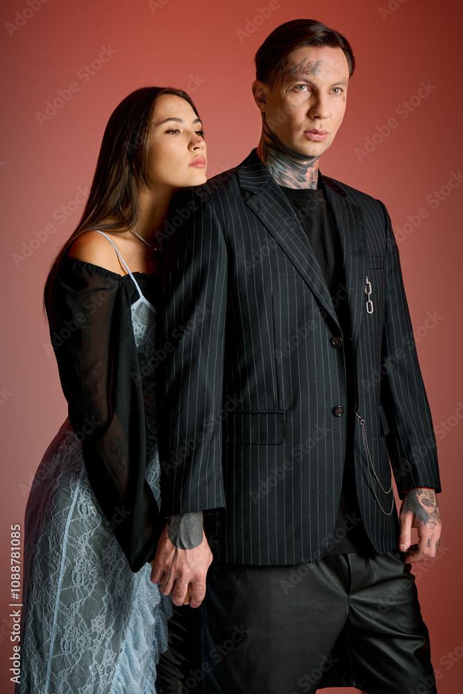A young man and woman showcase their fashion sense, holding hands and embracing creativity. A young man and woman showcase their fashion sense, holding hands and embracing creativity.