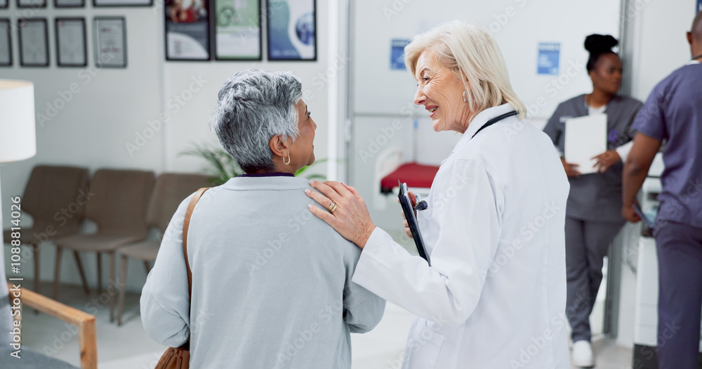 Obraz premium Doctor, back and consulting with old woman in hospital for meeting, diagnosis and healthcare results. Support, advice and report with people in clinic for medical exam, life insurance and patient