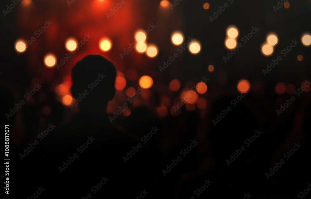 Crowd of people at a concert in the dark with red lighting Crowd of people at a concert in the dark with red lighting