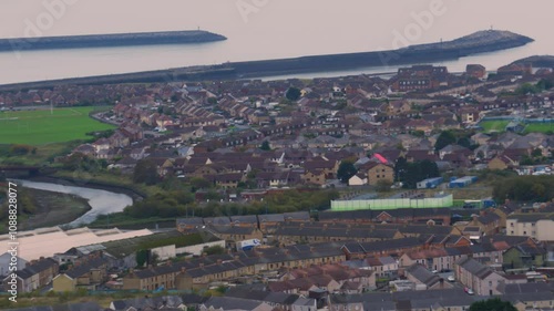 Pan Up Over Port Talbot Towards Aberavon Beach with Houses and Jetty on Overcast Day 4K photo