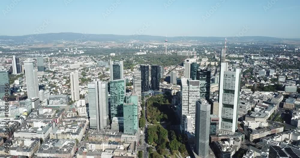 Frankfurt, Germany - September 20, 2020: Drone flight over the Main River, cityscape at sunset. Frankfurt, Germany - September 20, 2020: Drone flight over the Main River, cityscape at sunset.
