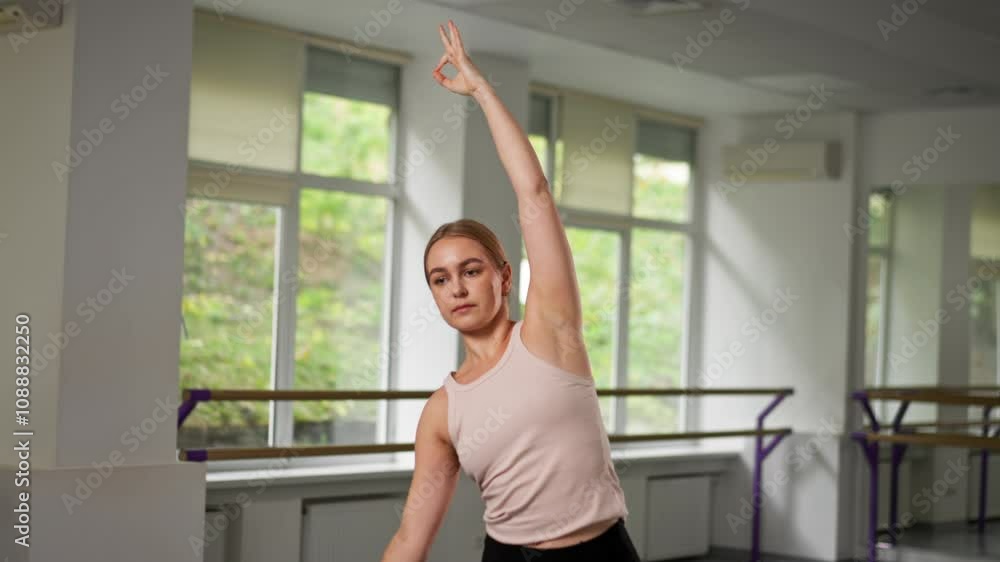 top shot in the studio of spiritual development master class on yoga a young girl in a bright room on purple mat does stretching for back top shot in the studio of spiritual development master class on yoga a young girl in a bright room on purple mat does stretching for back