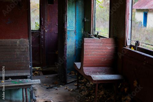 Abandoned train carriage. rusty, damaged and abandoned train carriage, peeling paint in Transcarpathia , Ukraine .Step into the past with this captivating image of a vintage train carriage. photo