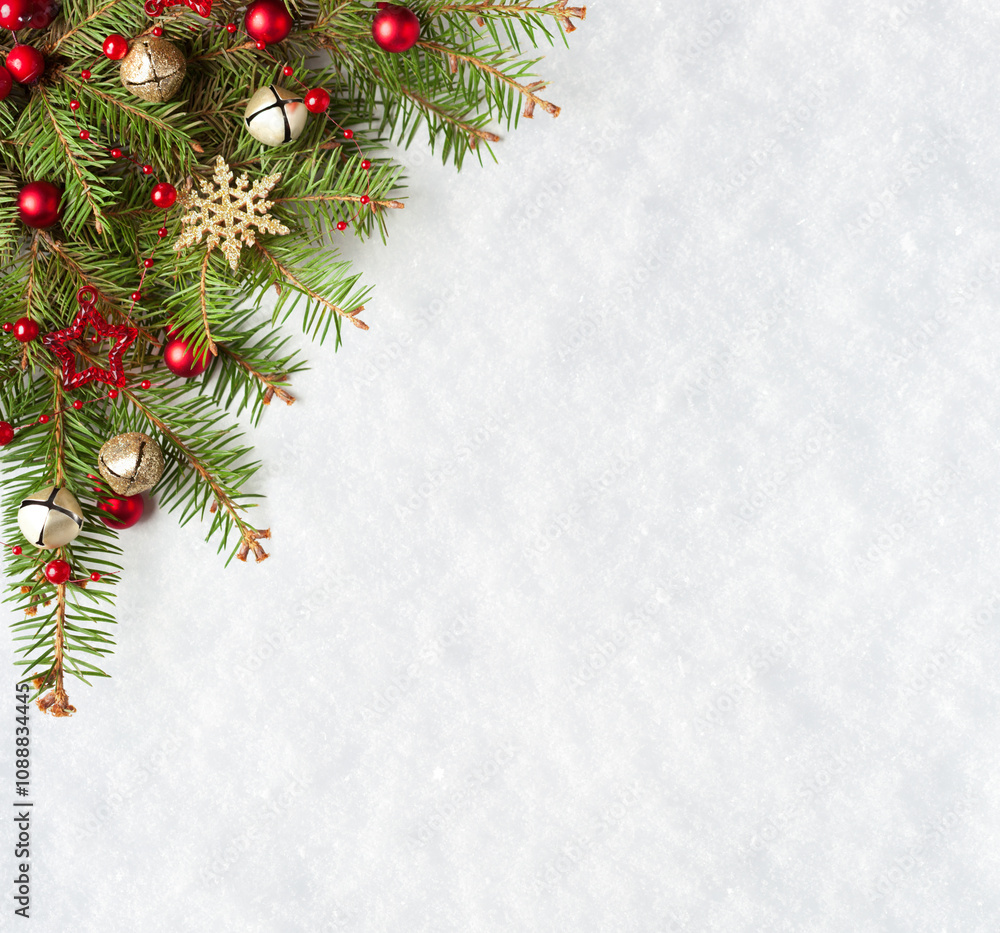 Christmas and New Year background. Christmas tree branches with decorations on the background of natural snow with empty space for text. Flat lay.