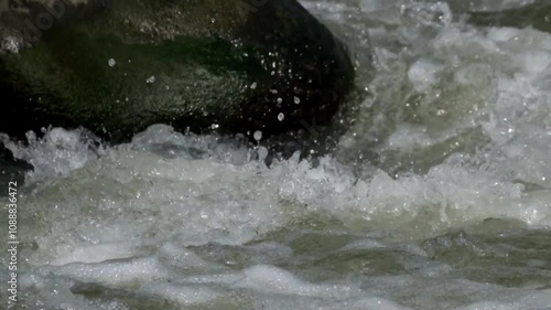 Wallpaper Mural The splash of fast river water over the rocks. The fast flow of river water. The water looks clean and fresh. The surface of the river water. Natural light, real time Torontodigital.ca