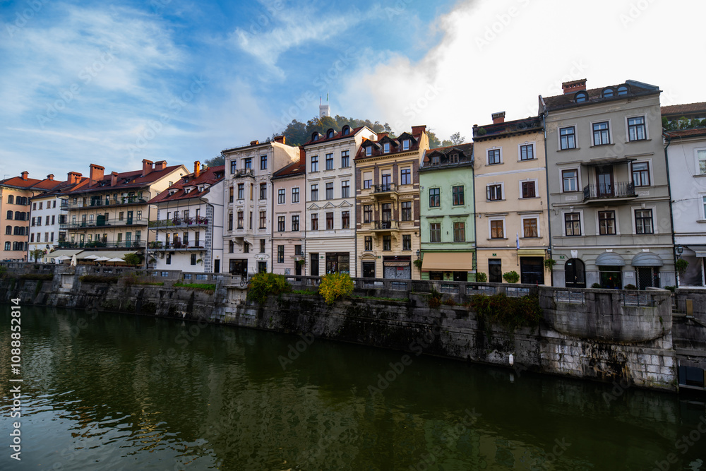 photography of colourfull buildings in front of the river Ljubljanica in Ljubljana, Slovenia during a foggy morning photography of colourfull buildings in front of the river Ljubljanica in Ljubljana, Slovenia during a foggy morning