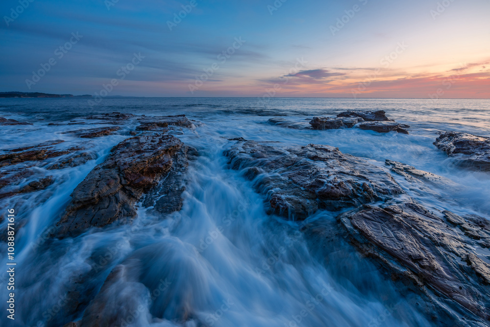 Dawn view on the rocky shore coastline. Dawn view on the rocky shore coastline.