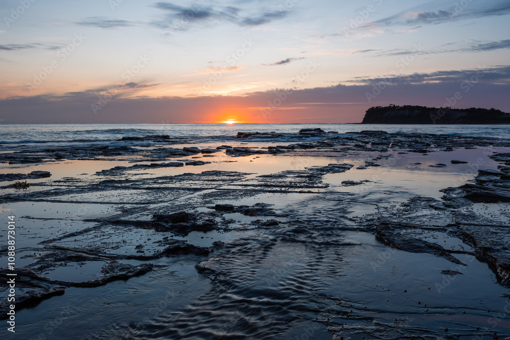 Sunrise view from the rocky beach shore. Sunrise view from the rocky beach shore.