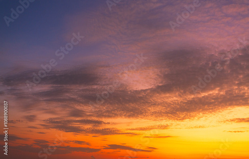 Orange sky and clouds background,Beautiful of luxury soft gradient orange gold clouds and sunlight on the blue sky perfect for the background, take in everning,Twilight