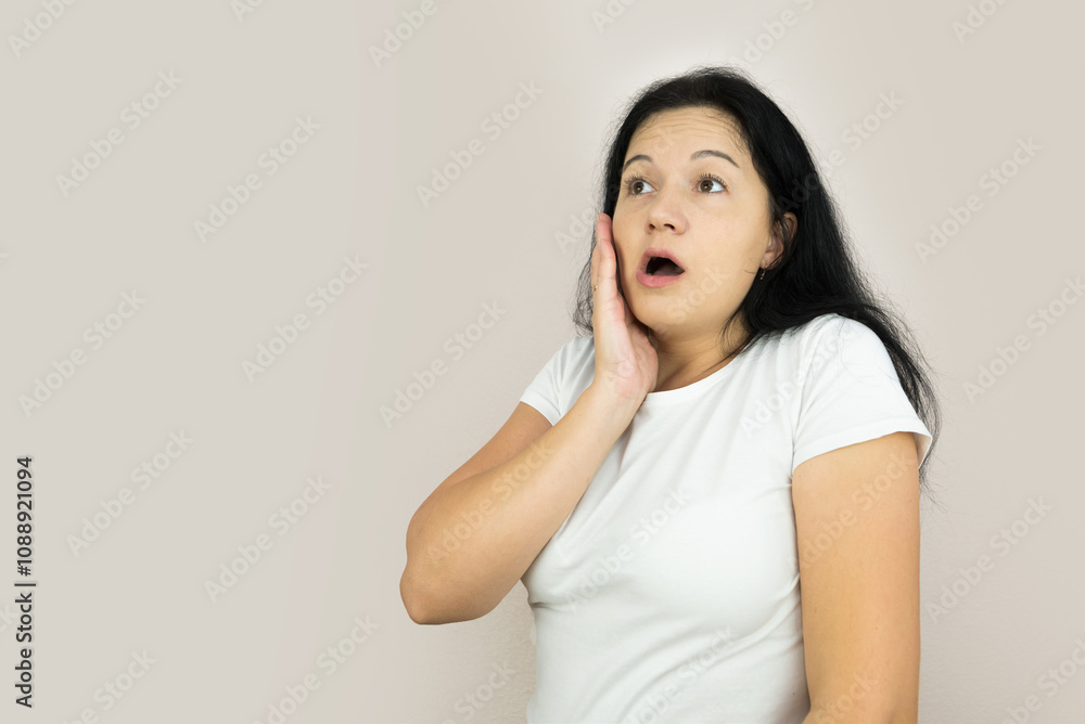 Lifestyle image of a young woman who is shocked and anxious Lifestyle image of a young woman who is shocked and anxious