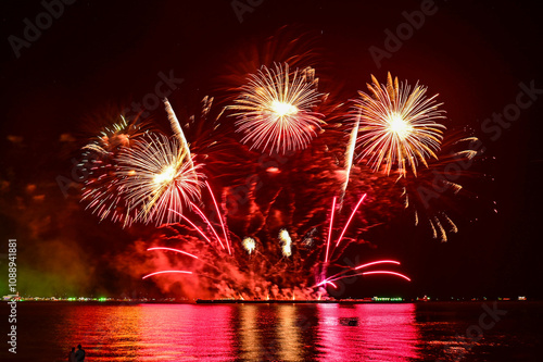 Beautiful fireworks set off in the middle of the sea.