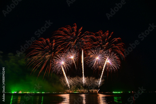 Beautiful fireworks set off in the middle of the sea.