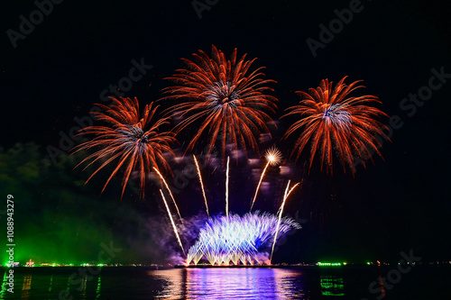 Beautiful fireworks set off in the middle of the sea.