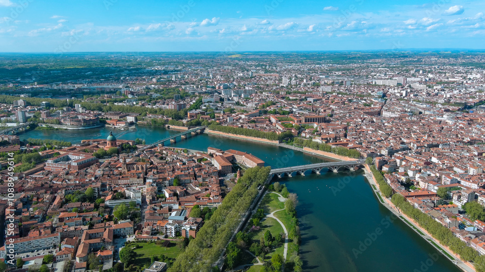 A stunning aerial panorama of Toulouse, France, with the iconic Garonne River winding through historic architecture and verdant parks A stunning aerial panorama of Toulouse, France, with the iconic Garonne River winding through historic architecture and verdant parks