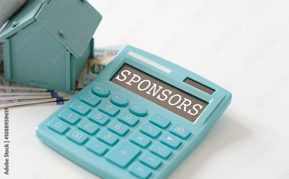 Word SPONSORED on tabl calculator. Finance concept Word SPONSORED on tabl calculator. Finance concept