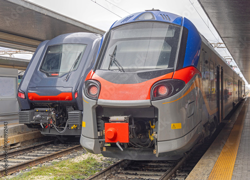 Two New Trains at Railway Station Venezia S Lucia in Venice Italy at Rainy Autumn Day photo