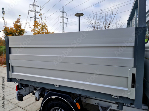 the truck has the side sides of the cargo space raised by the superstructure. lightweight aluminum sheets photo