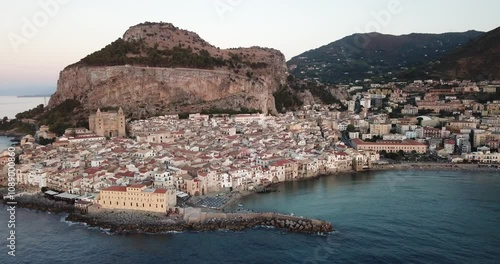 Aerial view, drone flight over Cefalu, a beautiful town at coastline in Sicily, Italy