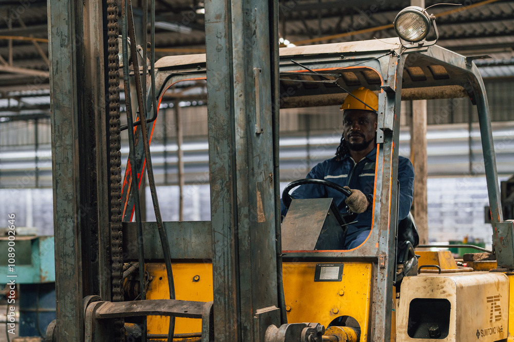 Naklejka premium Industrial worker indoors in old factory. Industrial man Engineers in Hard Hats.Work at the Heavy Industry Manufacturing Factory.