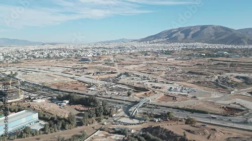 Aerial footage of a big, huge construction site in Athens, Greece, building, road, cranes, engineer, architecture developing photo