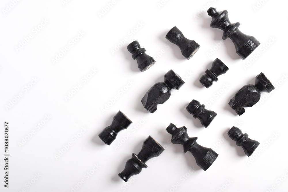 Top view of black chess pieces isolated on white background. Flat lay. Strategy idea Planning and business decision concept Top view of black chess pieces isolated on white background. Flat lay. Strategy idea Planning and business decision concept